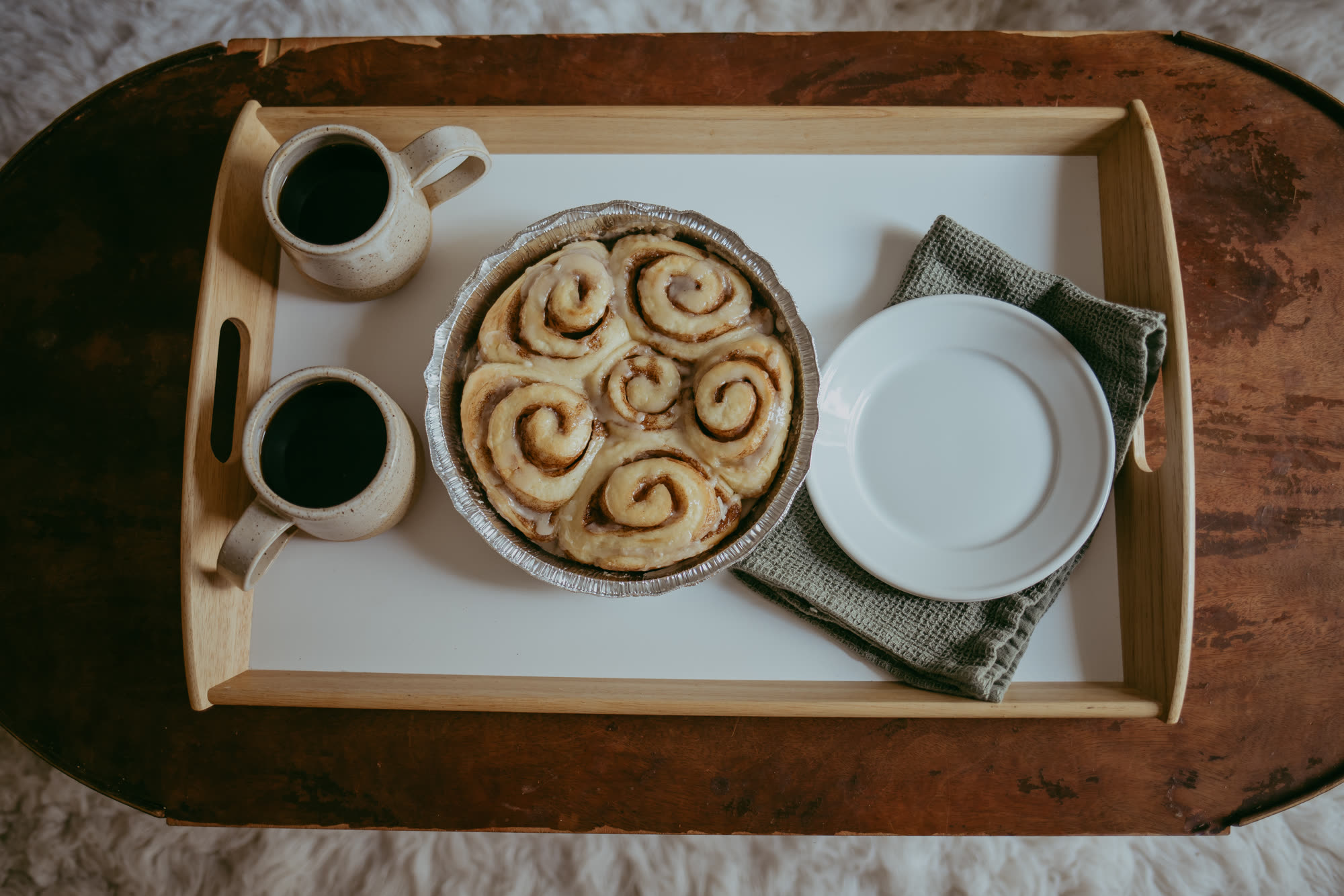Overhead view of a pan of soft hand-rolled cinnamon rolls