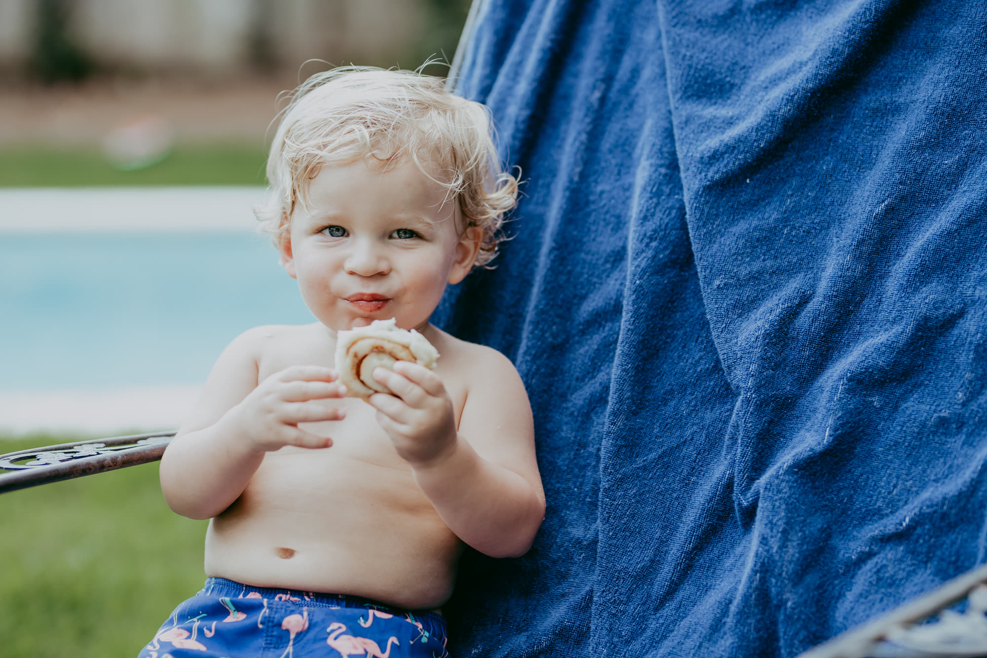 A child enjoying a LoveLee cinnamon roll